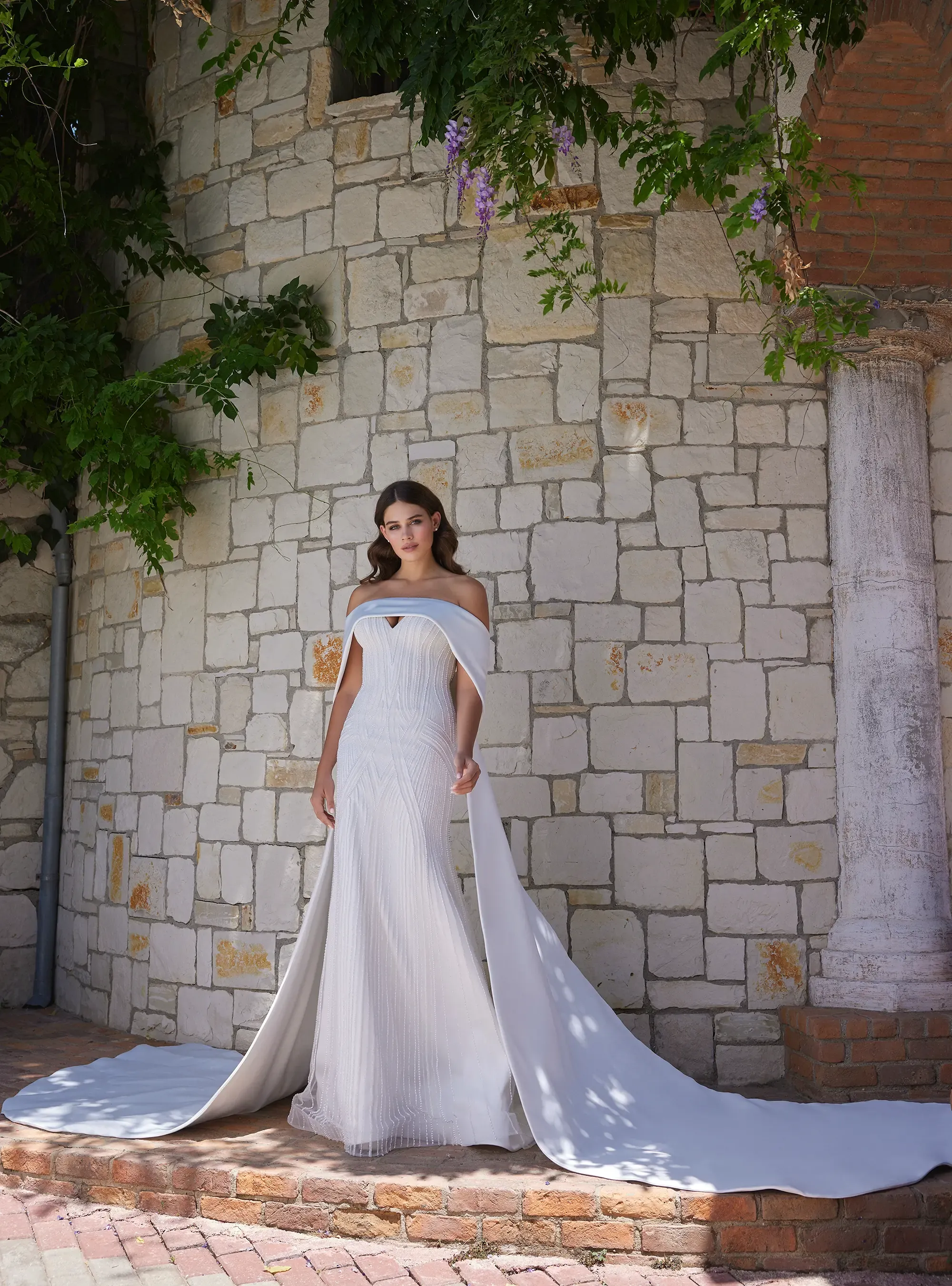 Romantic Mermaid Bridal Gown with Floral Accents and Detachable Skirt